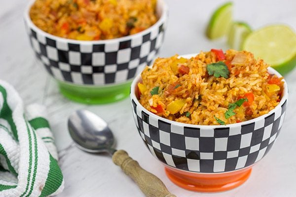 This Slow Cooker Spanish Rice is an easy and delicious side dish that's perfect for both the dog days of summer and the cold nights of winter!