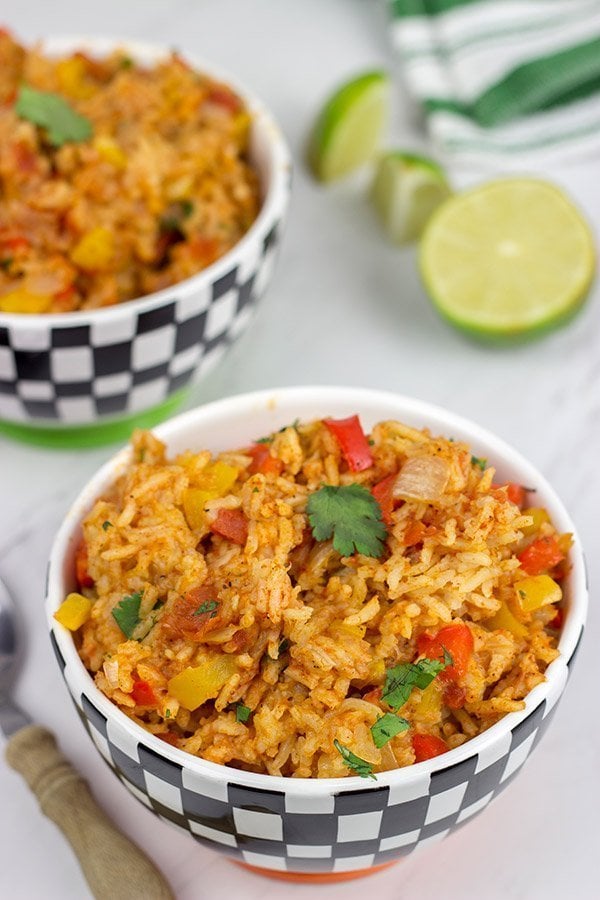 This Slow Cooker Spanish Rice is an easy and delicious side dish that's perfect for both the dog days of summer and the cold nights of winter!