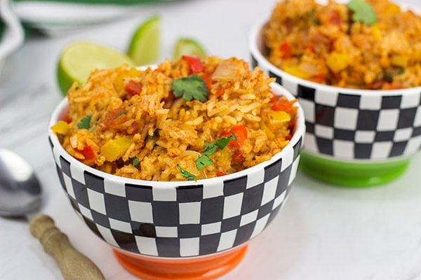 This Slow Cooker Spanish Rice is an easy and delicious side dish that's perfect for both the dog days of summer and the cold nights of winter!