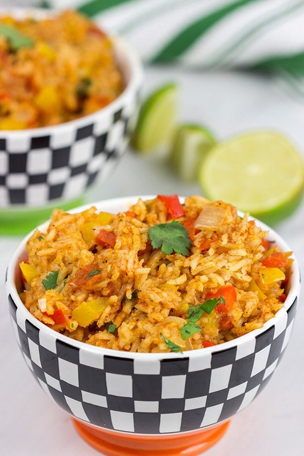 This Slow Cooker Spanish Rice is an easy and delicious side dish that's perfect for both the dog days of summer and the cold nights of winter!