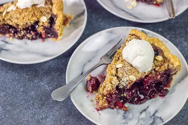 Topped with a combination of oats, brown sugar and cinnamon, this Cherry Crumb Pie is a delicious treat on a warm summer evening!