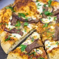 Mix up pizza night this week! This Steak and Gorgonzola pizza features seared ribeye steak along with dollops of creamy mozzarella and gorgonzola cheese. Yum!