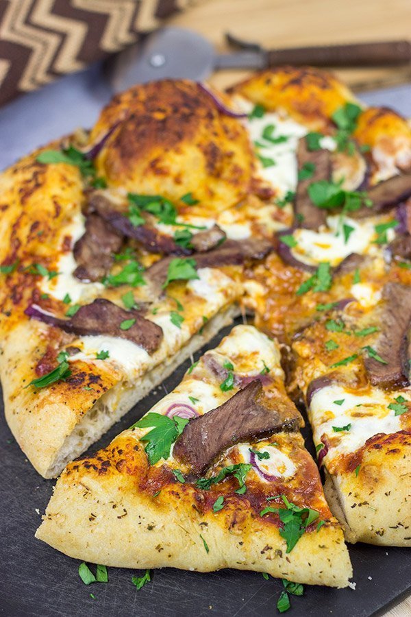 Mix up pizza night this week! This Steak and Gorgonzola pizza features seared ribeye steak along with dollops of creamy mozzarella and gorgonzola cheese. Yum!
