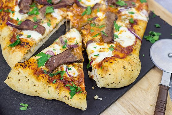 Mix up pizza night this week! This Steak and Gorgonzola pizza features seared ribeye steak along with dollops of creamy mozzarella and gorgonzola cheese. Yum!