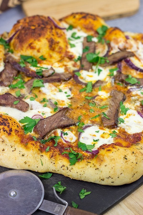 Mix up pizza night this week! This Steak and Gorgonzola pizza features seared ribeye steak along with dollops of creamy mozzarella and gorgonzola cheese. Yum!