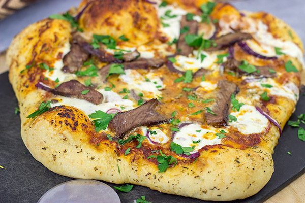 Mix up pizza night this week! This Steak and Gorgonzola pizza features seared ribeye steak along with dollops of creamy mozzarella and gorgonzola cheese. Yum!