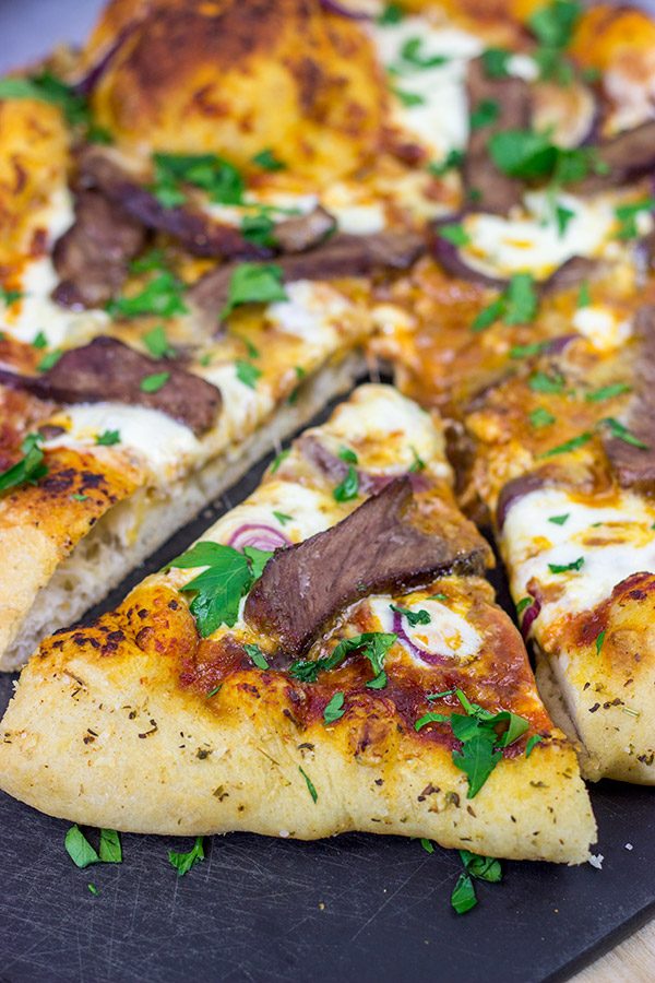 Mix up pizza night this week! This Steak and Gorgonzola pizza features seared ribeye steak along with dollops of creamy mozzarella and gorgonzola cheese. Yum!