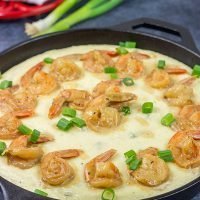 These New Orleans-style BBQ Shrimp and Grits don't involve barbecue sauce...but this recipe is a New Orleans classic for a reason! Talk about delicious comfort food!