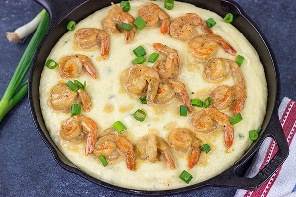These New Orleans-style BBQ Shrimp and Grits don't involve barbecue sauce...but this recipe is a New Orleans classic for a reason!  Talk about delicious comfort food!