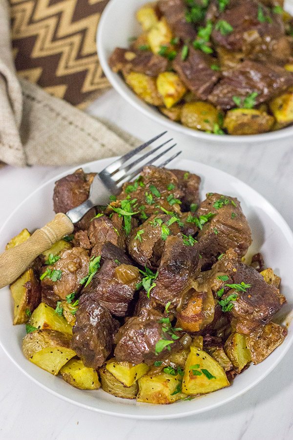 Carbonade Flamande is a traditional Belgian dish consisting of beef short ribs simmered in Belgian ale and then served over fries or roasted potatoes.  It's the perfect comfort food for cold weather!