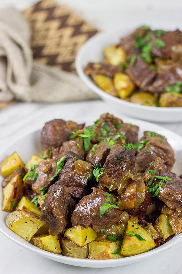 Carbonade Flamande is a traditional Belgian dish consisting of beef short ribs simmered in Belgian ale and then served over fries or roasted potatoes.  It's the perfect comfort food for cold weather!