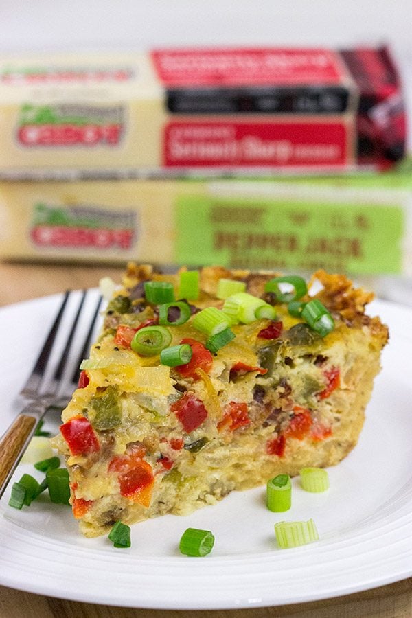 Let's do brunch the right way!  This Cheesy Quiche with Hash Brown Crust is loaded with 2 types of cheese, bacon, onions and peppers.  Yum!
