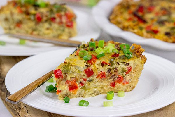 Let's do brunch the right way!  This Cheesy Quiche with Hash Brown Crust is loaded with 2 types of cheese, bacon, onions and peppers.  Yum!