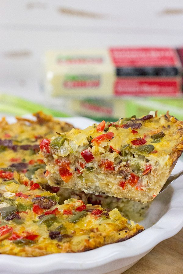 Let's do brunch the right way!  This Cheesy Quiche with Hash Brown Crust is loaded with 2 types of cheese, bacon, onions and peppers.  Yum!