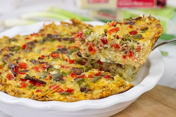 Let's do brunch the right way!  This Cheesy Quiche with Hash Brown Crust is loaded with 2 types of cheese, bacon, onions and peppers.  Yum!