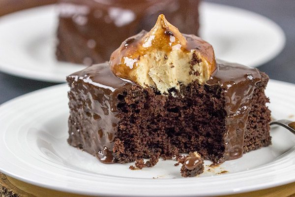 Decadent chocolate cake topped with a scoop of whipped peanut butter frosting...and then coated with chocolate glaze!  These Chocolate Peanut Butter Radio Bars are one heck of an awesome dessert!