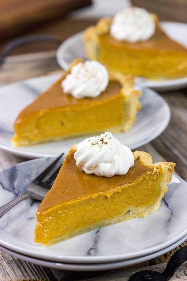 This Classic Pumpkin Pie features an extra silky pumpkin filling and a flaky pie crust.  It makes for one tasty sweet Autumn treat!