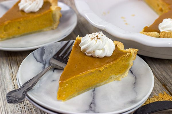 This Classic Pumpkin Pie features an extra silky pumpkin filling and a flaky pie crust.  It makes for one tasty sweet Autumn treat!
