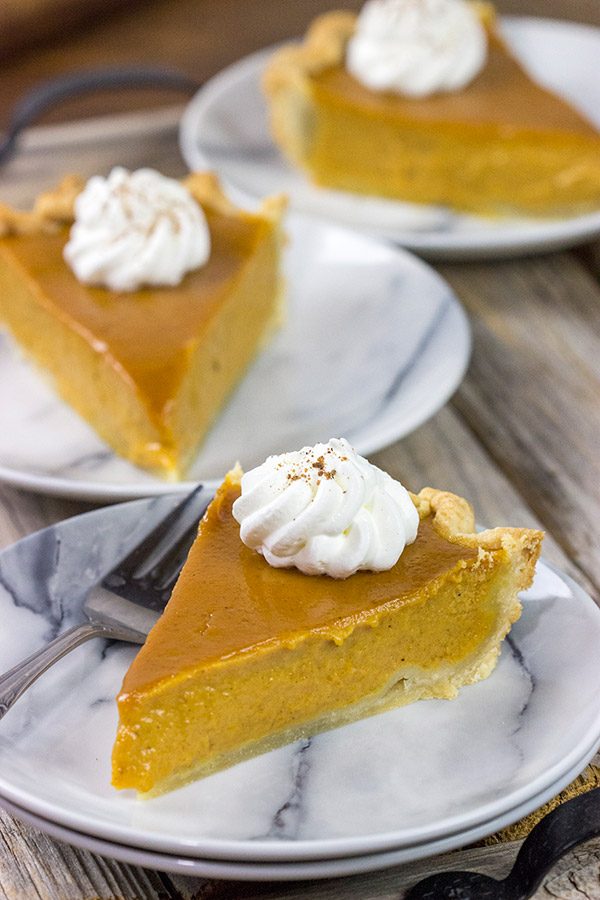 This Classic Pumpkin Pie features an extra silky pumpkin filling and a flaky pie crust.  It makes for one tasty sweet Autumn treat!