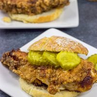 Fried Chicken and Biscuits is a classic recipe for a reason! Homemade buttermilk biscuits topped with juicy fried chicken make for one heck of a comfort food meal!