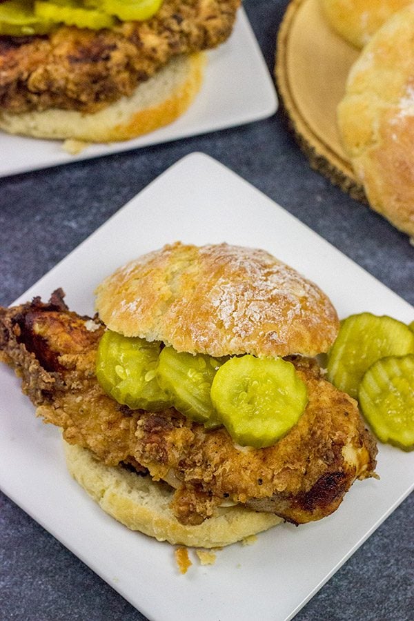 Fried Chicken and Biscuits is a classic recipe for a reason!  Homemade buttermilk biscuits topped with juicy fried chicken make for one heck of a comfort food meal!