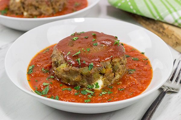 This Mozzarella-Stuffed Meatloaf is packed with comfort food flavor...and melty cheese!  This ain't your grandma's meatloaf recipe!
