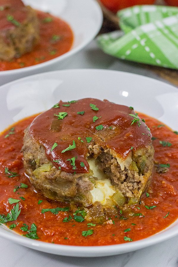 This Mozzarella-Stuffed Meatloaf is packed with comfort food flavor...and melty cheese!  This ain't your grandma's meatloaf recipe!