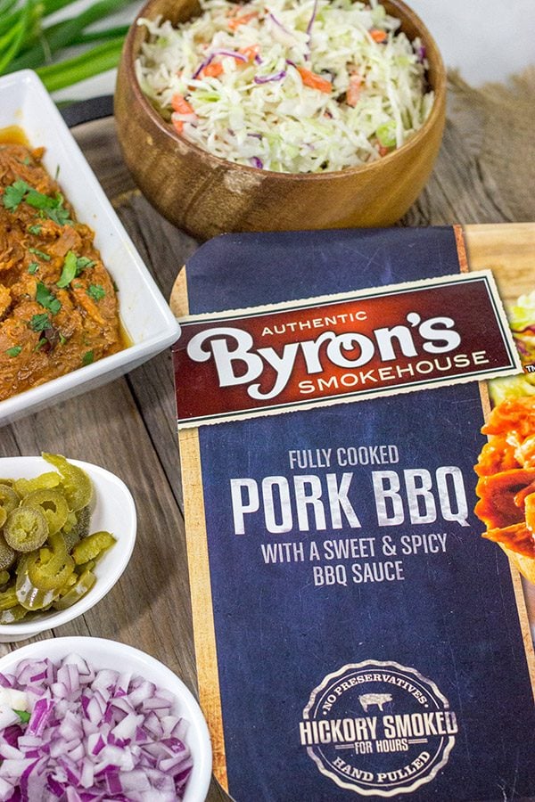 Kick off BBQ season the right way! These Pulled Pork Totchos are topped with pulled pork, cole slaw and pepper jack queso. This delicious appetizer will be the hit of the party!