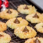 These Coconut Chocolate Kiss Cookies are a fun twist on the classic sugar cookie!  Toasted coconut + melty chocolate combine for a tasty sweet treat!