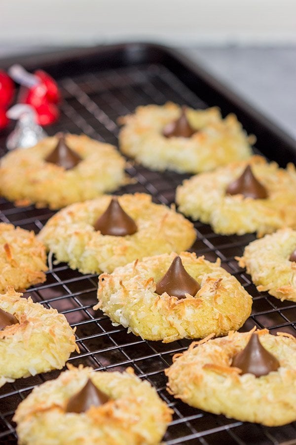 These Coconut Chocolate Kiss Cookies are a fun twist on the classic sugar cookie! Toasted coconut + melty chocolate combine for a tasty sweet treat!
