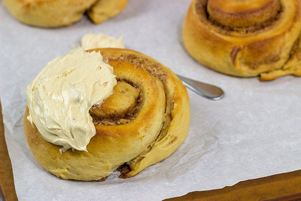If you love peanut butter, then these Peanut Butter Cinnamon Rolls will be a new favorite!  Topped with a whipped peanut butter frosting, these rolls are a tasty breakfast or dessert!
