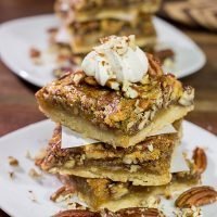 There's a reason why pecan pie is a holiday staple!  These Pecan Pie Bars feature a buttery shortbread crust topped with a gooey pecan pie filling.  They're perfect for grabbing and gobbling!