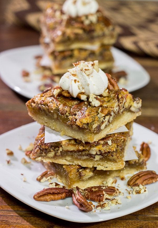 There's a reason why pecan pie is a holiday staple!  These Pecan Pie Bars feature a buttery shortbread crust topped with a gooey pecan pie filling.  They're perfect for grabbing and gobbling!
