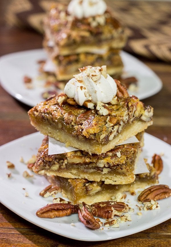 There's a reason why pecan pie is a holiday staple!  These Pecan Pie Bars feature a buttery shortbread crust topped with a gooey pecan pie filling.  They're perfect for grabbing and gobbling!