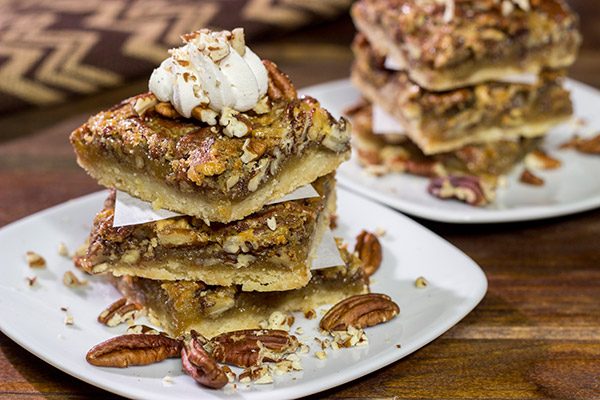 There's a reason why pecan pie is a holiday staple!  These Pecan Pie Bars feature a buttery shortbread crust topped with a gooey pecan pie filling.  They're perfect for grabbing and gobbling!