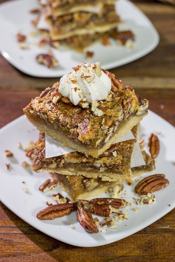 There's a reason why pecan pie is a holiday staple!  These Pecan Pie Bars feature a buttery shortbread crust topped with a gooey pecan pie filling.  They're perfect for grabbing and gobbling!