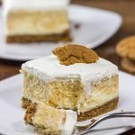 These Pumpkin Swirl Cheesecake Bars feature creamy cheesecake topped with a vanilla bean whipped cream...all over a gingersnap crust!  Talk about the perfect Autumn dessert!