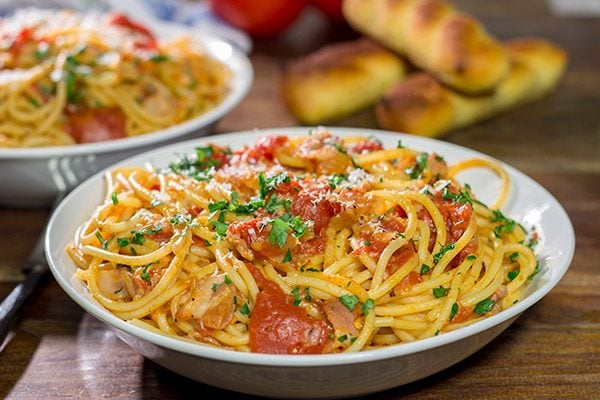 Spaghetti all'Amatriciana is a classic and delicious Italian pasta dish.  It's loaded with layers of flavor, and it'll become a family favorite for sure!