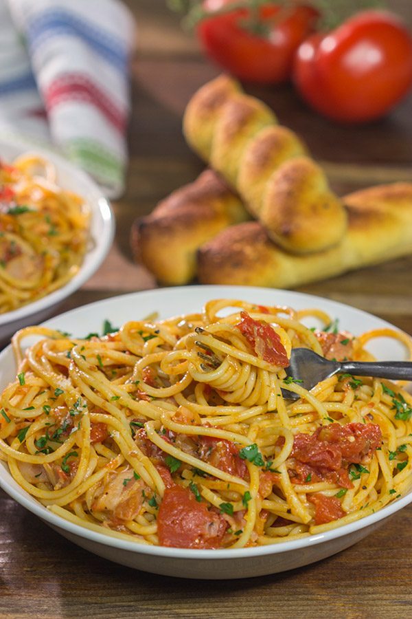 Spaghetti all'Amatriciana is a classic and delicious Italian pasta dish.  It's loaded with layers of flavor, and it'll become a family favorite for sure!