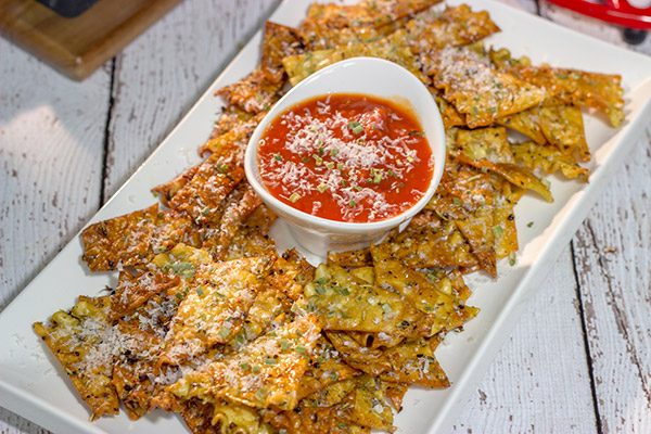 Looking for a fun snack to serve during football season?  These Italian Herb Baked Lasagna Chips are a unique (and tasty) addition to the appetizer menu!