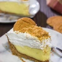 Baked in a gingersnap cookie crust, this Eggnog Cream Pie makes for one heck of a delicious treat during the holidays! Cheers!