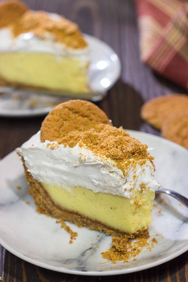Baked in a gingersnap cookie crust, this Eggnog Cream Pie makes for one heck of a delicious treat during the holidays! Cheers!