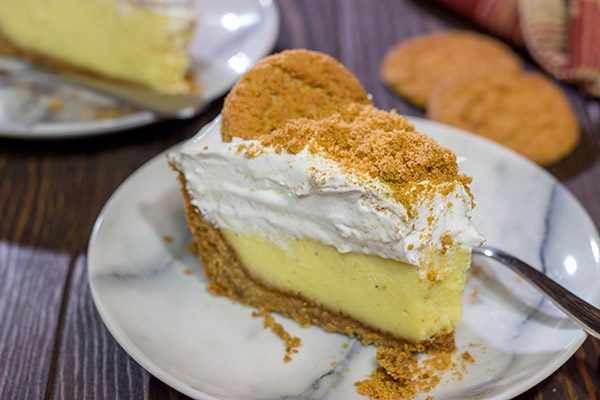 Baked in a gingersnap cookie crust, this Eggnog Cream Pie makes for one heck of a delicious treat during the holidays!  Cheers!