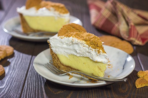 Baked in a gingersnap cookie crust, this Eggnog Cream Pie makes for one heck of a delicious treat during the holidays!  Cheers!