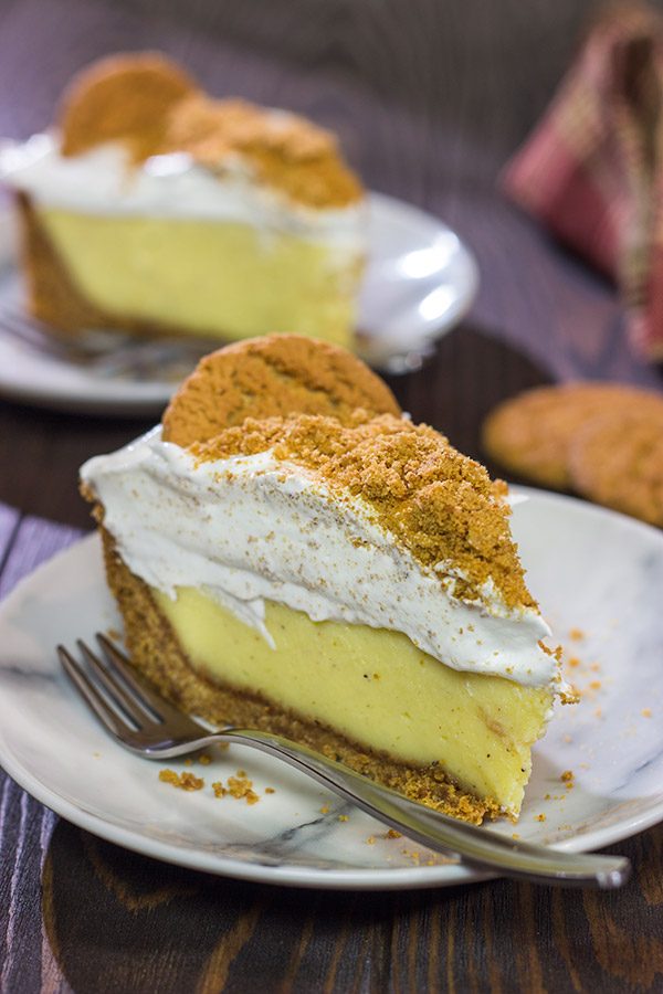 Baked in a gingersnap cookie crust, this Eggnog Cream Pie makes for one heck of a delicious treat during the holidays!  Cheers!