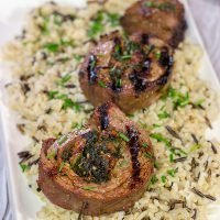 Impress your family and friends with this Grilled Stuffed Flank Steak! Stuffed with spinach and roasted red peppers, this steak is a delicious option for the summer grill!