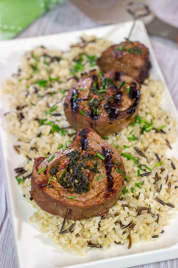 Impress your family and friends with this Grilled Stuffed Flank Steak!  Stuffed with spinach and roasted red peppers, this steak is a delicious option for the summer grill!