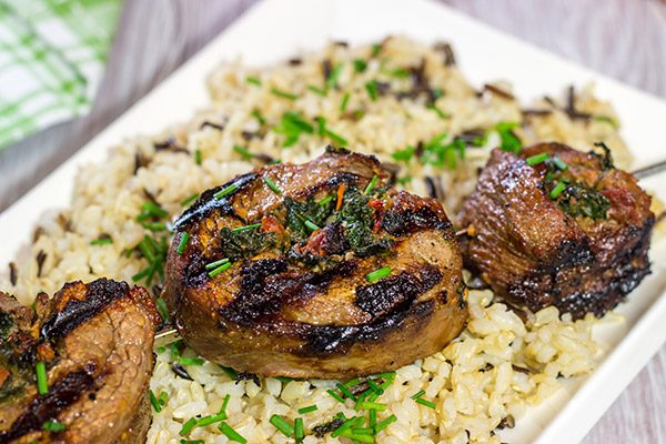 Impress your family and friends with this Grilled Stuffed Flank Steak!  Stuffed with spinach and roasted red peppers, this steak is a delicious option for the summer grill!