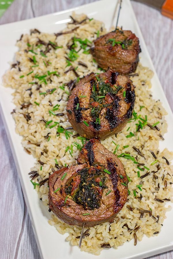 Impress your family and friends with this Grilled Stuffed Flank Steak!  Stuffed with spinach and roasted red peppers, this steak is a delicious option for the summer grill!