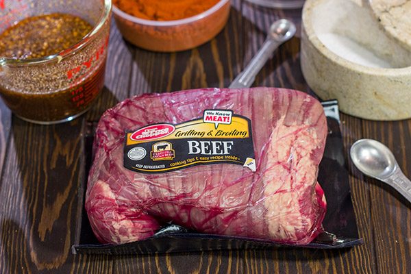 Impress your family and friends with this Grilled Stuffed Flank Steak!  Stuffed with spinach and roasted red peppers, this steak is a delicious option for the summer grill!